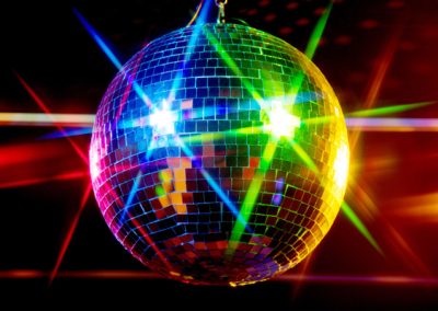 Disco ball with multi-coloured lights reflecting off it